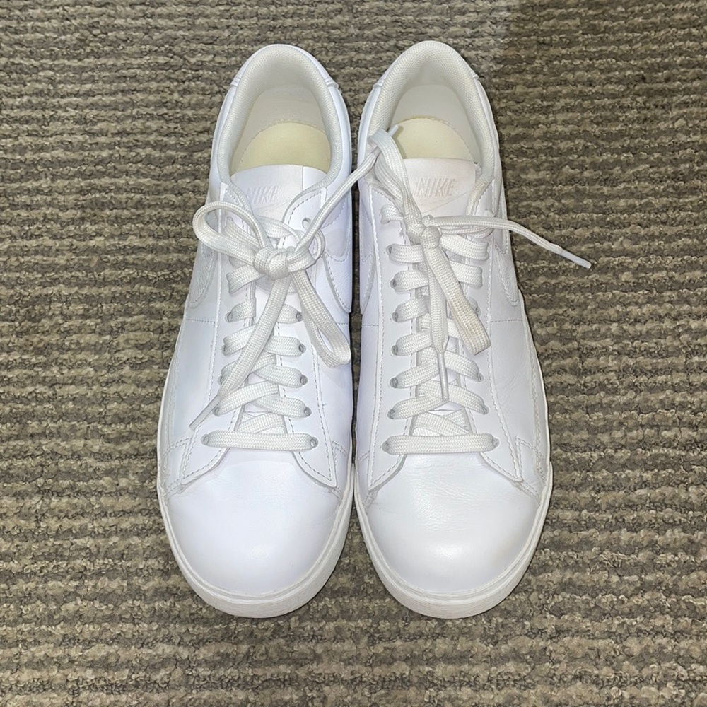 White, Nike low-top blazers.